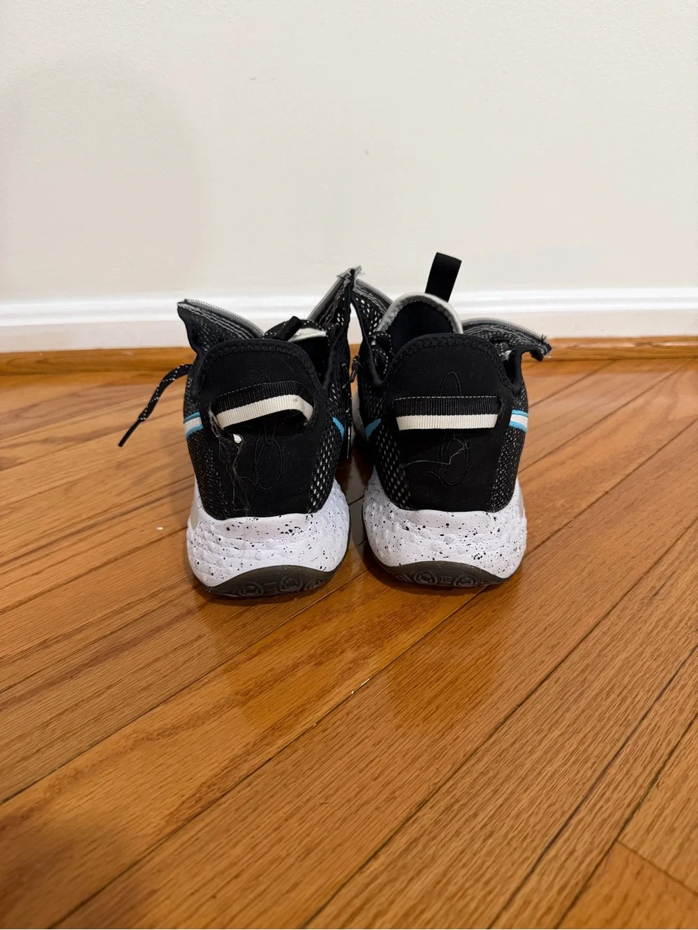 Nike Men’s Paul George 4 Black and White Sneakers with Teal Swoosh